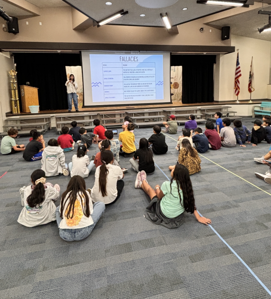 Charlene Cheng (12) prepares elementary debate students for their upcoming debate tournament.